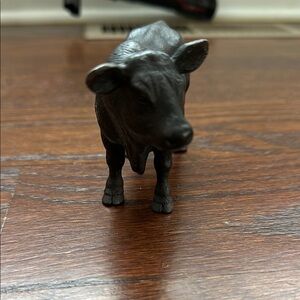 Black Action Figure of a Bovine Animal